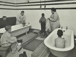 Attendants bathing boys at the Sun Court Cleansing Station, London ...